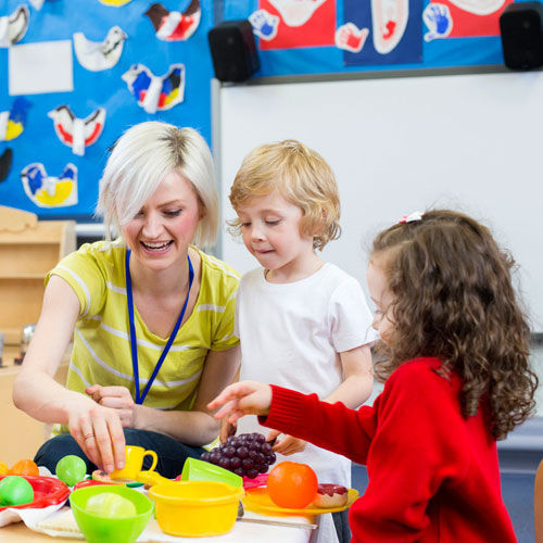 Children and daycare teacher having fun